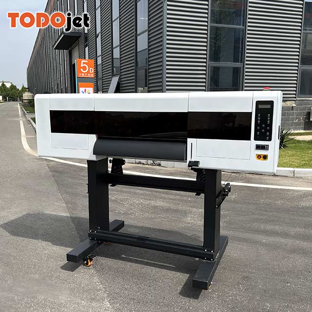 Hot in Spain Professional Senior cmykw dtf printer 65cm pet film kits shake powder cotton fabric t-shirt printing machine